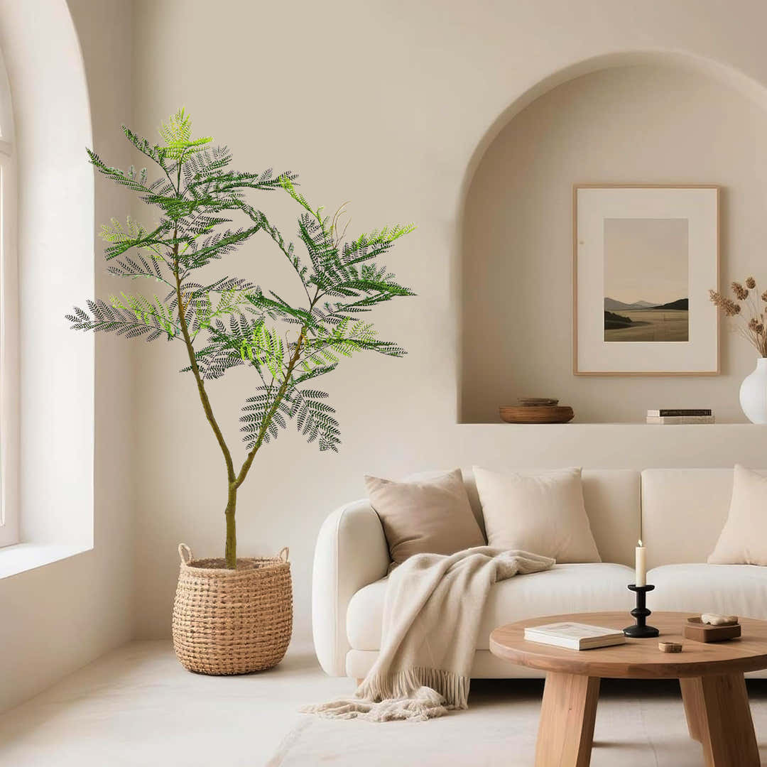 Artificial tree styled in a bright interior with a full, realistic silhouette