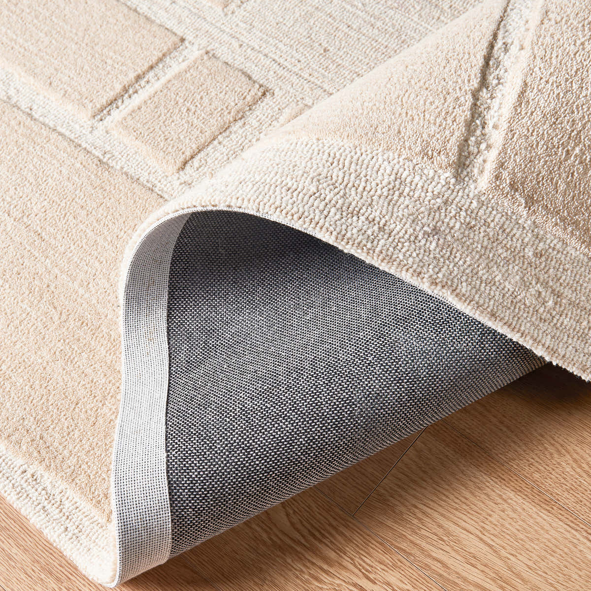 Living room rug styling with sofa and décor