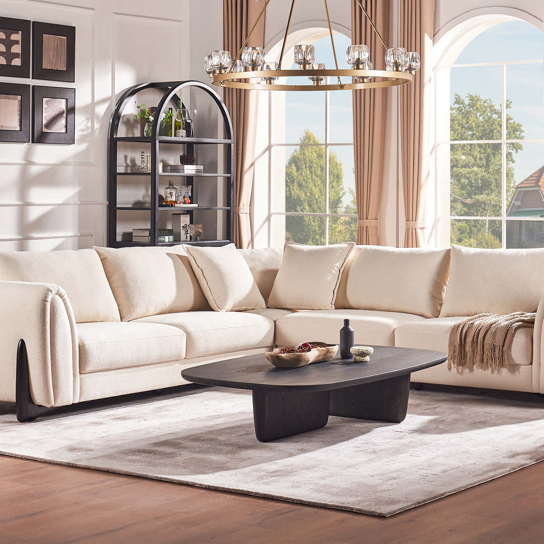 Neutral-toned sofa in a spacious room, illustrating how scale and layout affect comfort and movement paths
